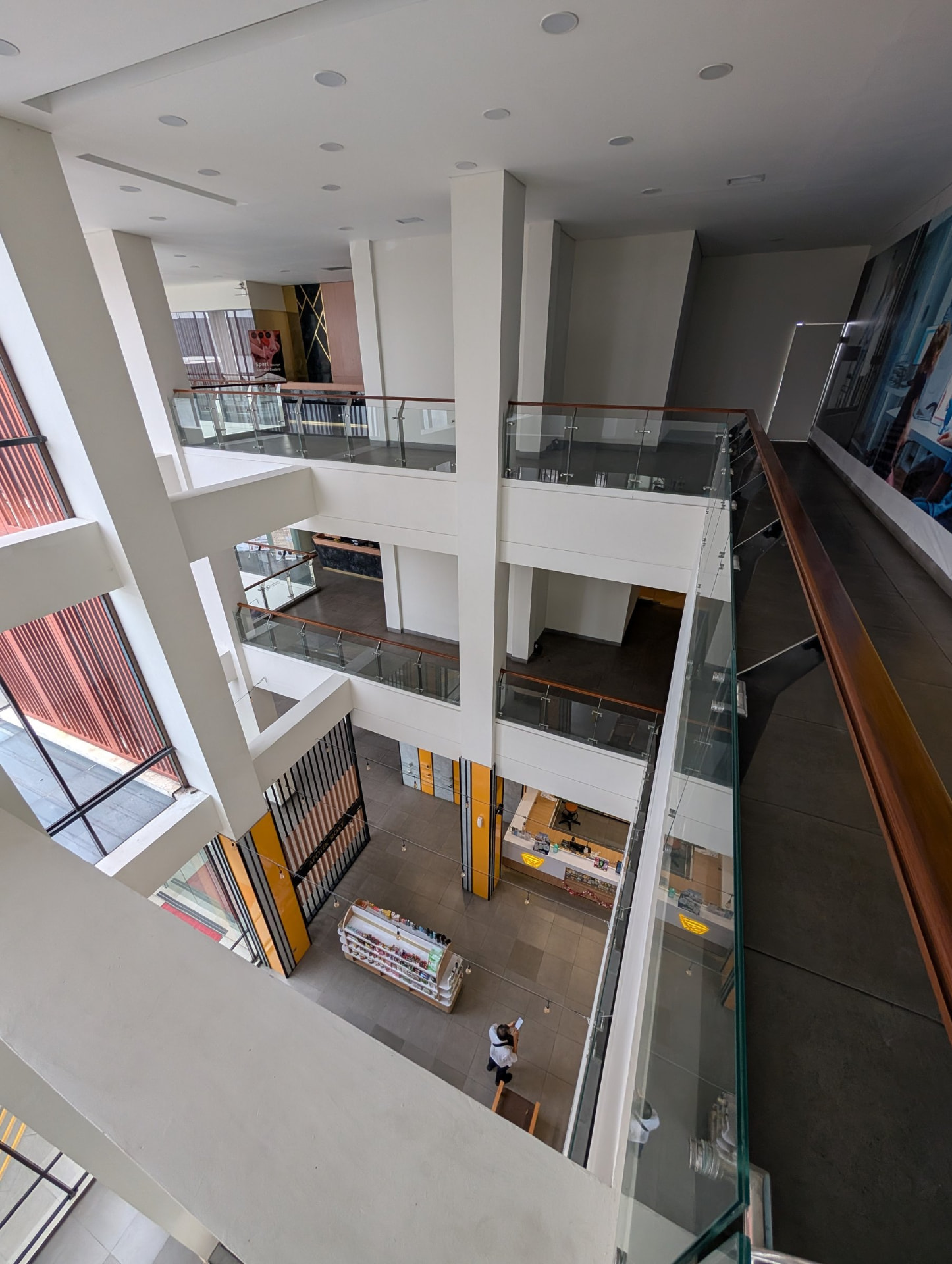 Ground floor of the building with a pharmacy counter and product shelving seen from above