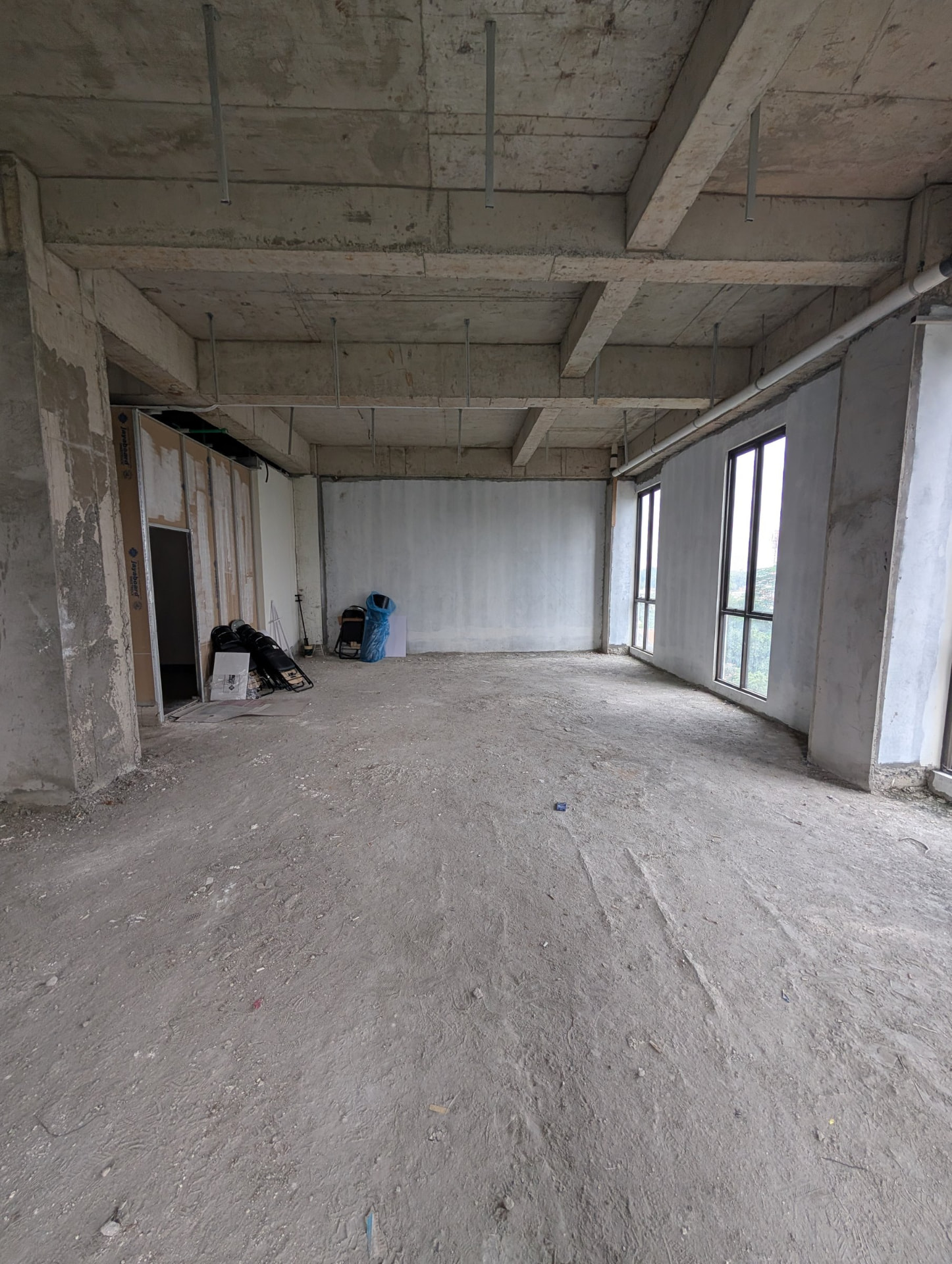 Another third-floor area with a row of tall windows facing outside
